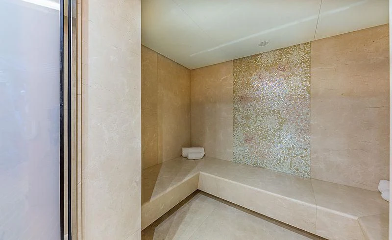 a bathroom with marble tiles aboard SPECTRE Yacht for Sale