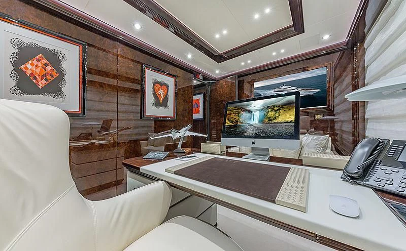 a room with a desk and a computer aboard SPECTRE Yacht for Sale