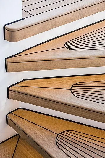 a wooden shelf with a few books aboard SPECTRE Yacht for Sale