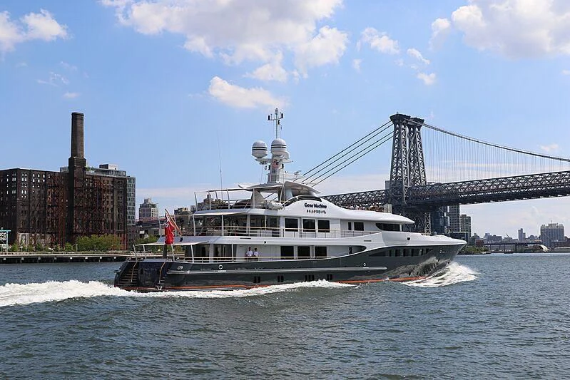 a boat sailing under a bridge aboard GENE MACHINE Yacht for Sale