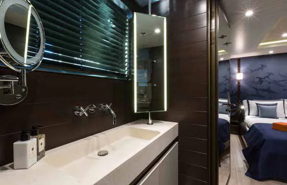 a bathroom with a sink and a mirror aboard GENE MACHINE Yacht for Sale
