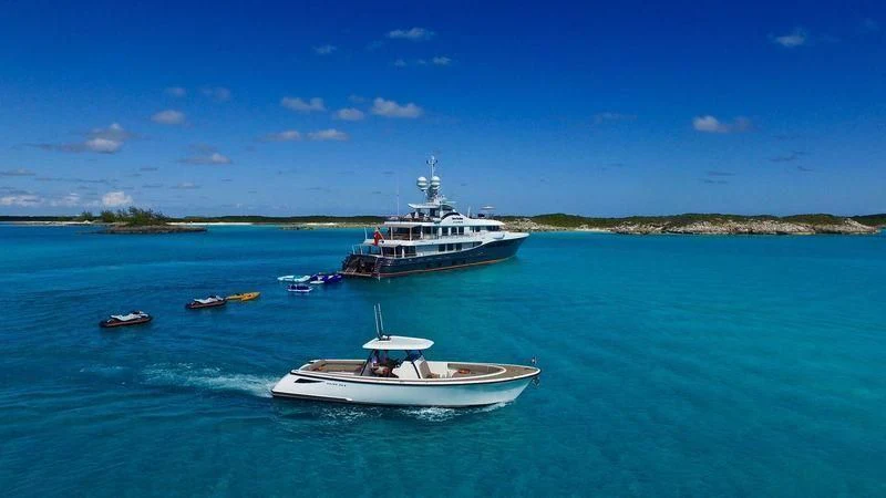 a boat and a boat in the water aboard GENE MACHINE Yacht for Sale