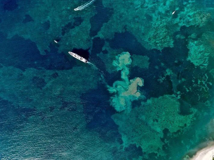 an aerial view of a plane aboard GENE MACHINE Yacht for Sale