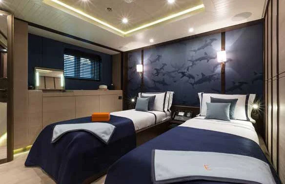 a room with two beds aboard GENE MACHINE Yacht for Sale