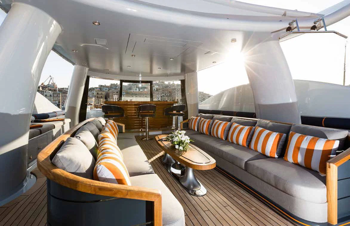 a room with a couch and a table aboard GENE MACHINE Yacht for Sale