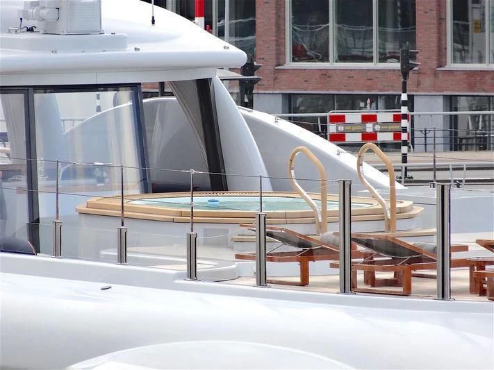 a sculpture of a bicycle on a sidewalk aboard GENE MACHINE Yacht for Sale