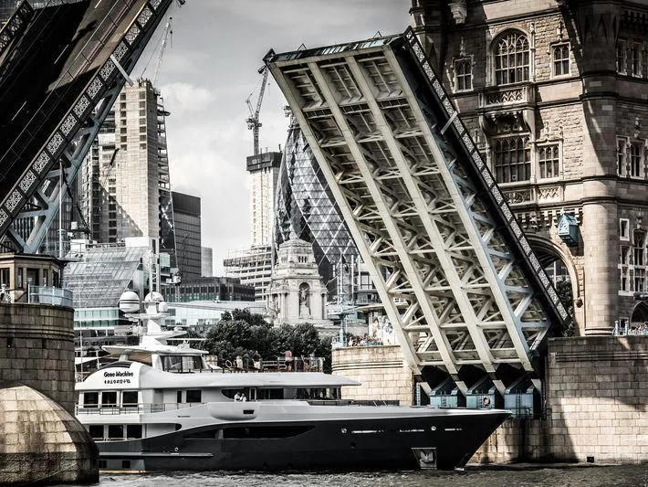 a boat in a canal aboard GENE MACHINE Yacht for Sale