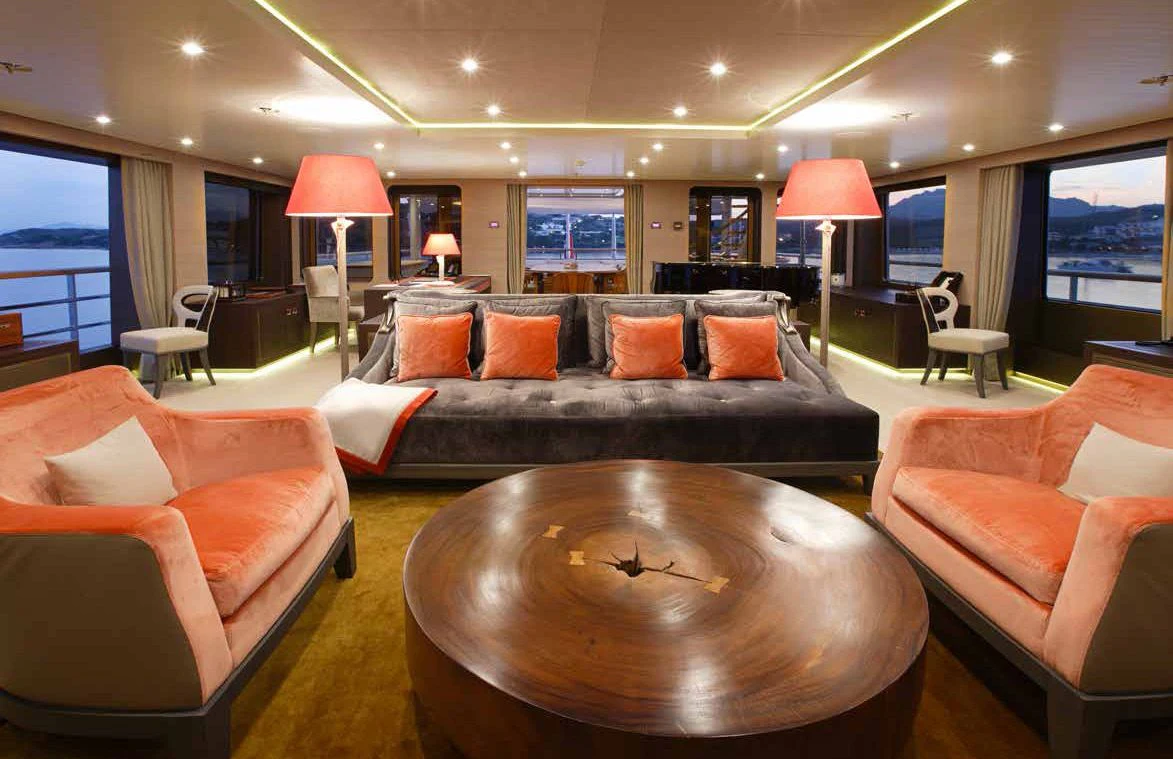 a living room with a leather couch aboard GENE MACHINE Yacht for Sale
