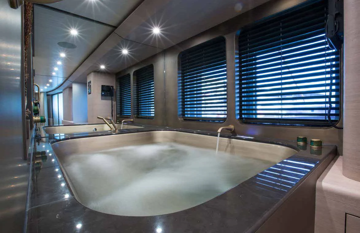 a large bathroom with a large jacuzzi tub aboard GENE MACHINE Yacht for Sale