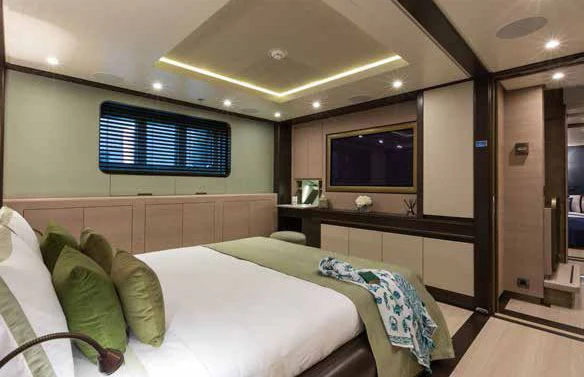 a room with a bed and a tv aboard GENE MACHINE Yacht for Sale