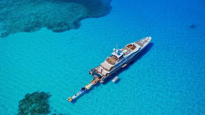 a spaceship over a planet aboard GENE MACHINE Yacht for Sale