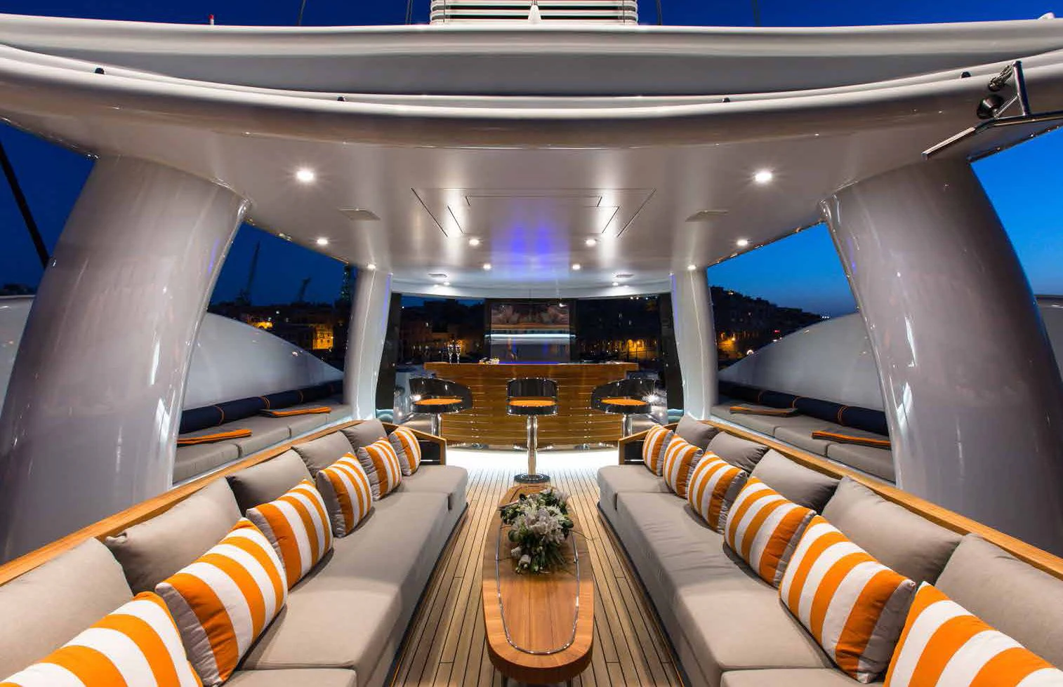 a room with couches and a table aboard GENE MACHINE Yacht for Sale