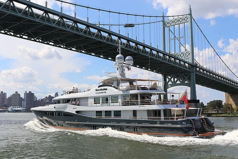 a boat under a bridge aboard GENE MACHINE Yacht for Sale