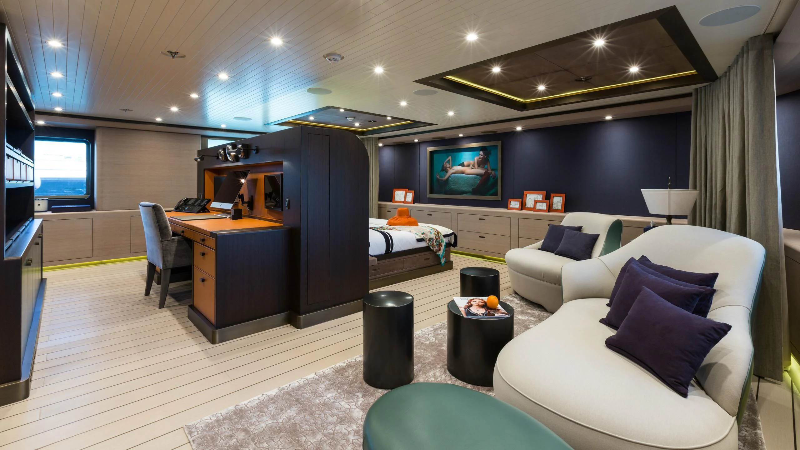 a room with a couch and a tv aboard GENE MACHINE Yacht for Sale