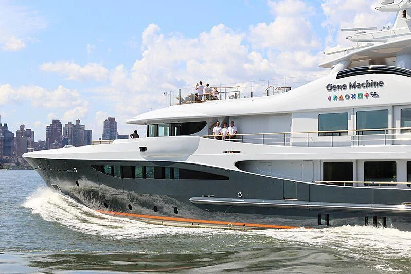 a large white boat with people on it aboard GENE MACHINE Yacht for Sale