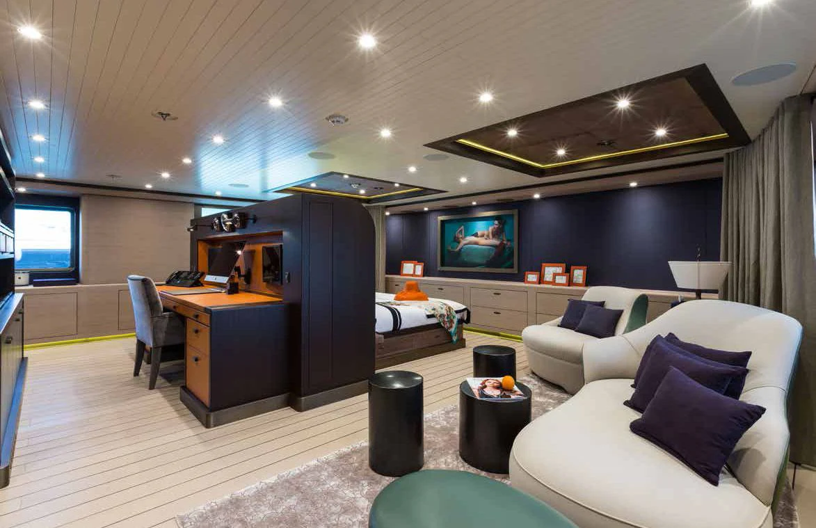 a living room with a couch and a tv aboard GENE MACHINE Yacht for Sale