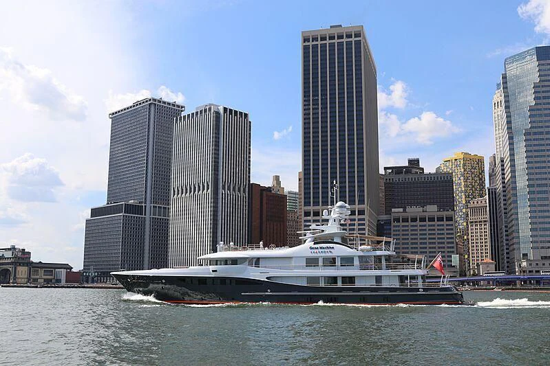 a ferry on the water with Renaissance Center in the background aboard GENE MACHINE Yacht for Sale