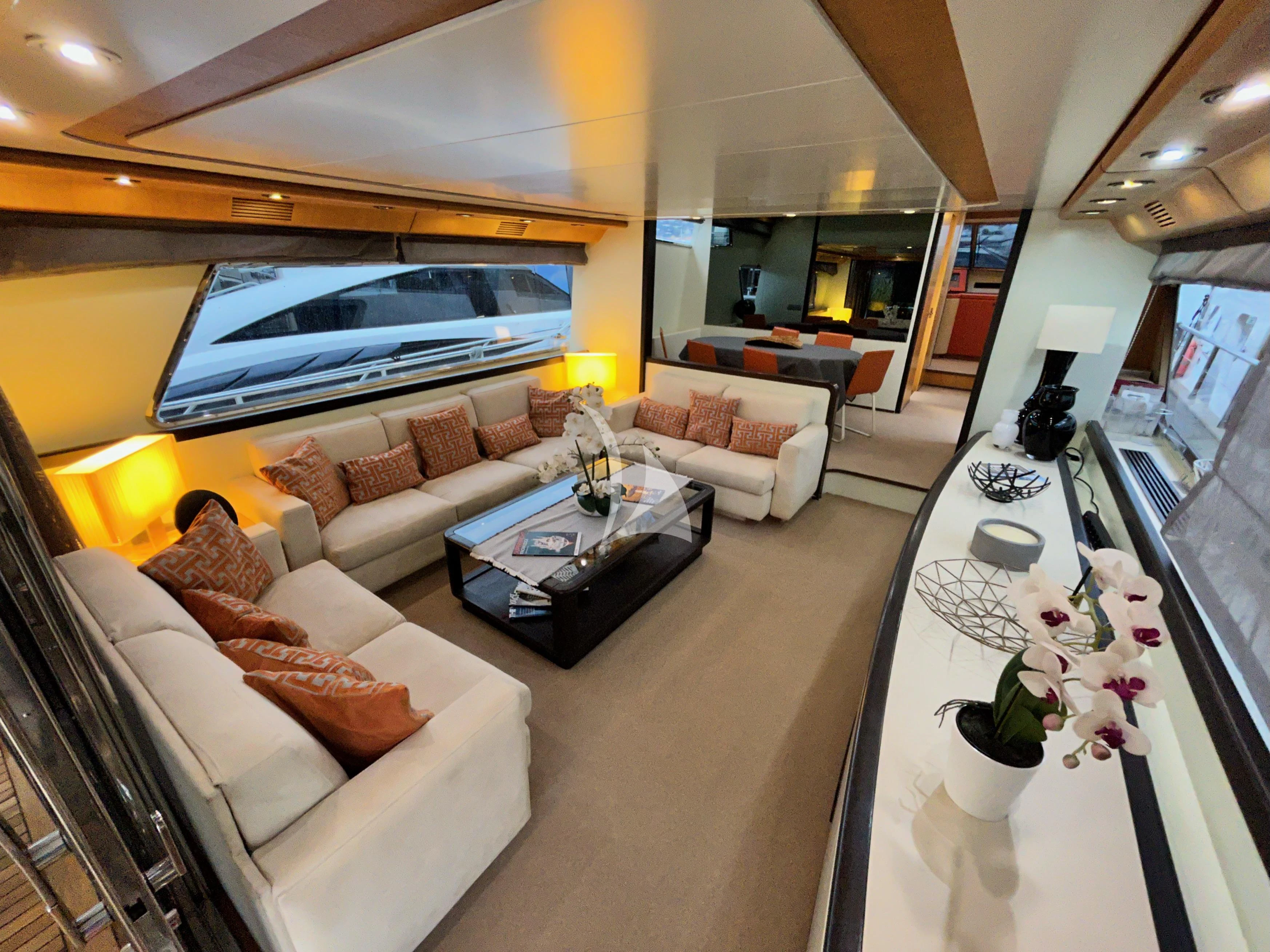 a living room with a large window aboard LOLEA Yacht for Charter