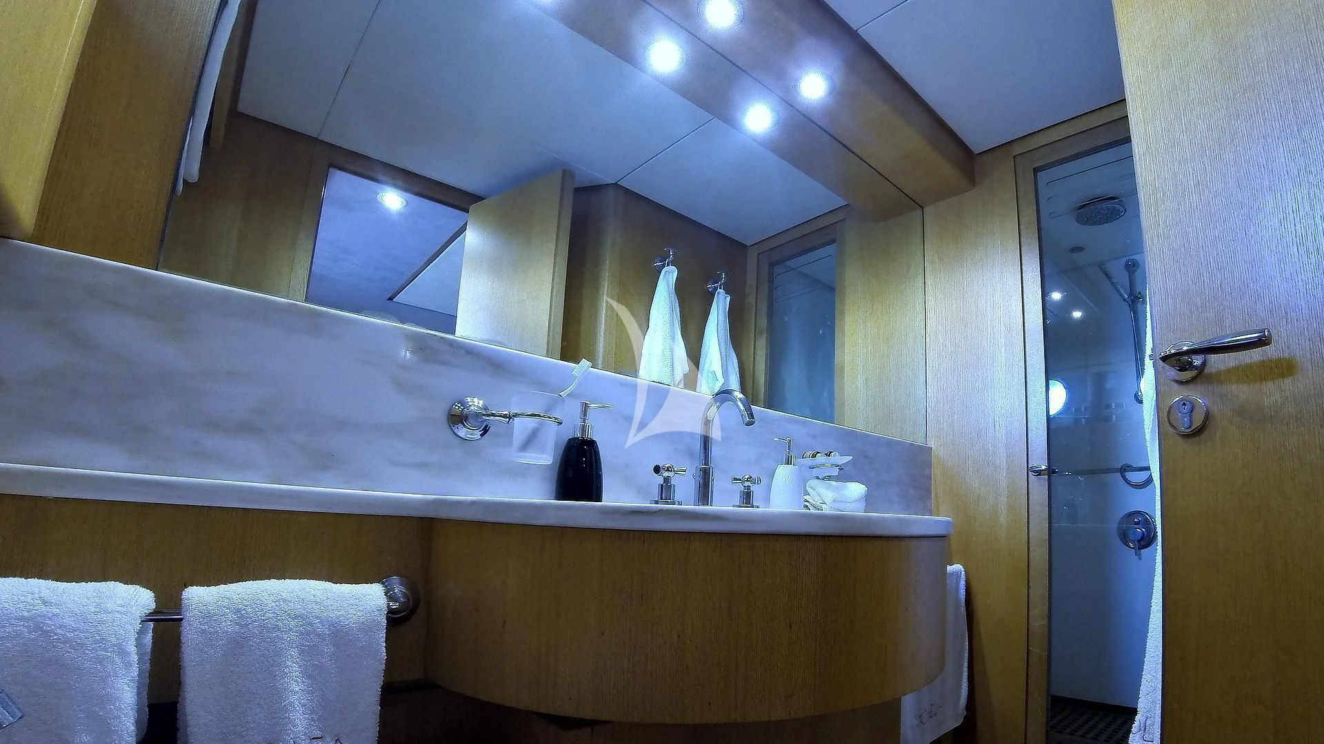 a bathroom with a large mirror aboard LOLEA Yacht for Charter