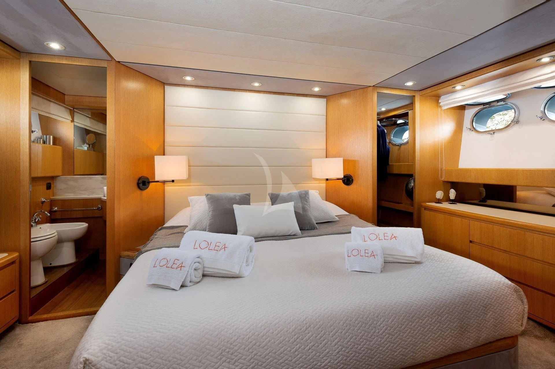a large bed in a hotel room aboard LOLEA Yacht for Charter