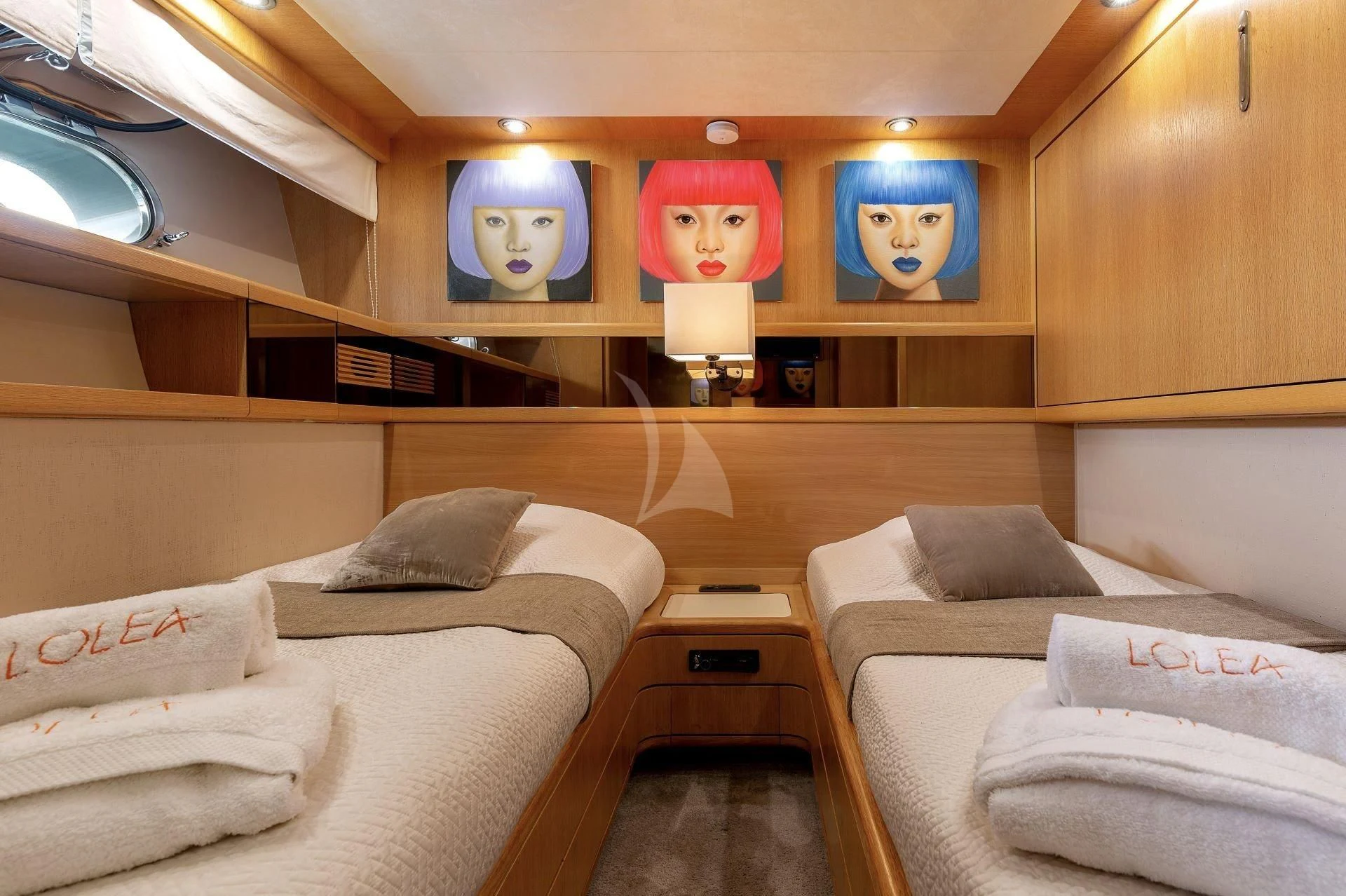 a room with a couple beds aboard LOLEA Yacht for Charter
