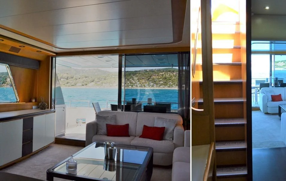 a living room with a large window aboard LOLEA Yacht for Charter
