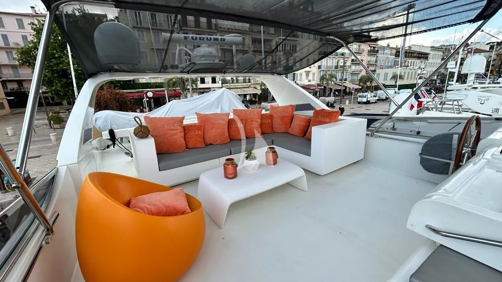 a couch with pillows on it aboard LOLEA Yacht for Charter