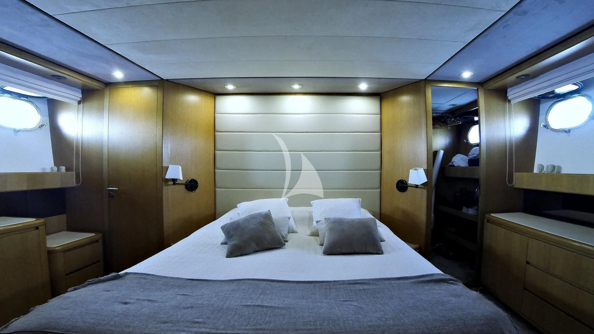 a bed in a room aboard LOLEA Yacht for Charter