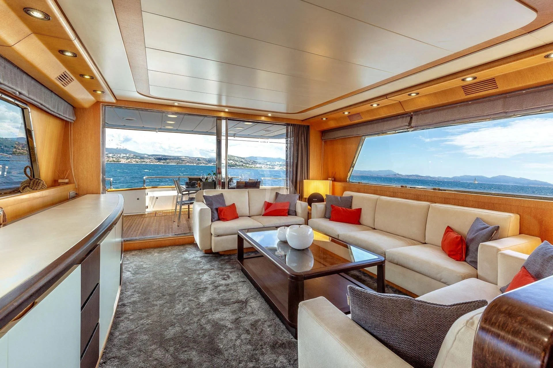 a living room with a large window aboard LOLEA Yacht for Charter