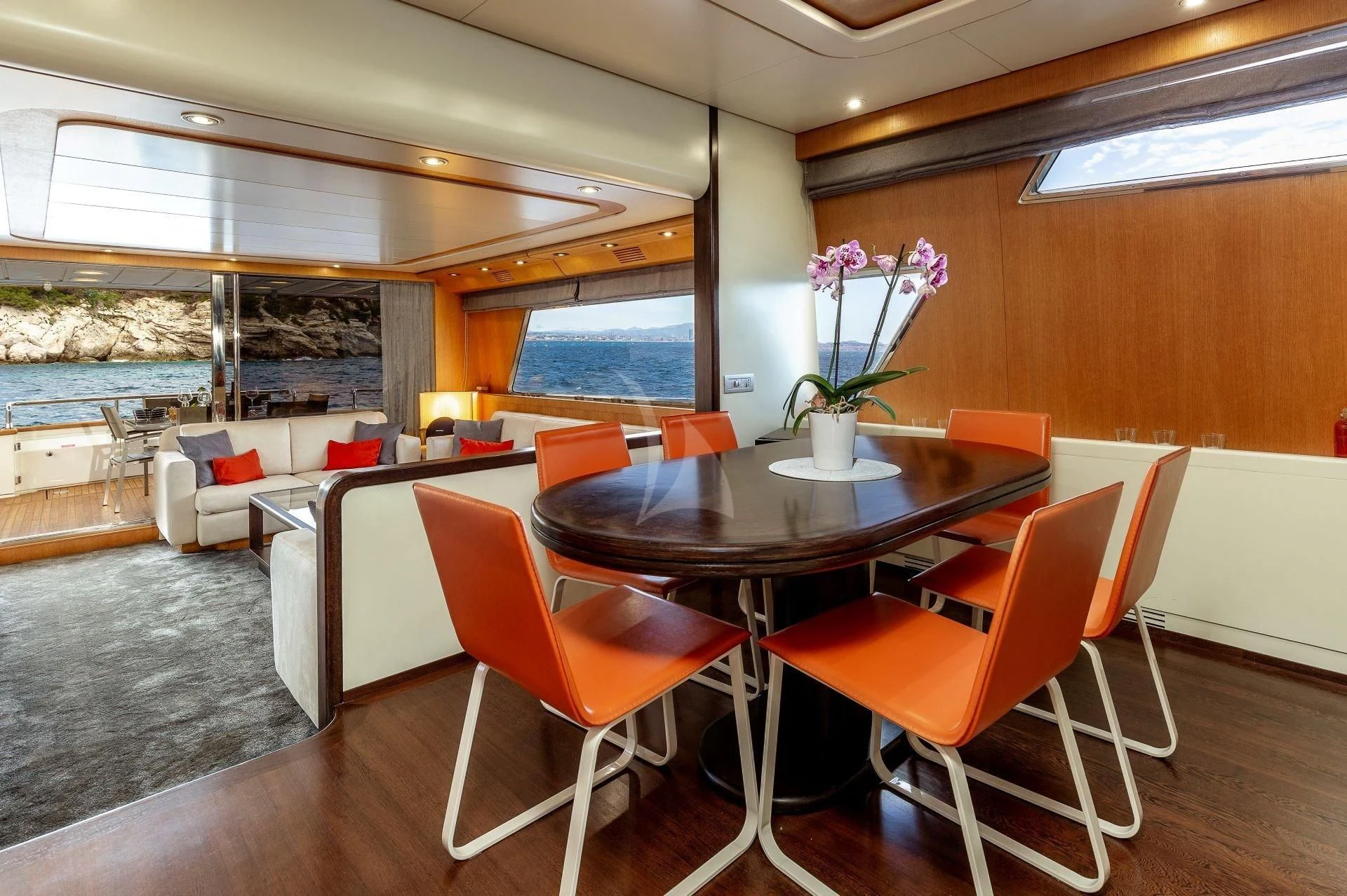 a room with a table and chairs aboard LOLEA Yacht for Charter