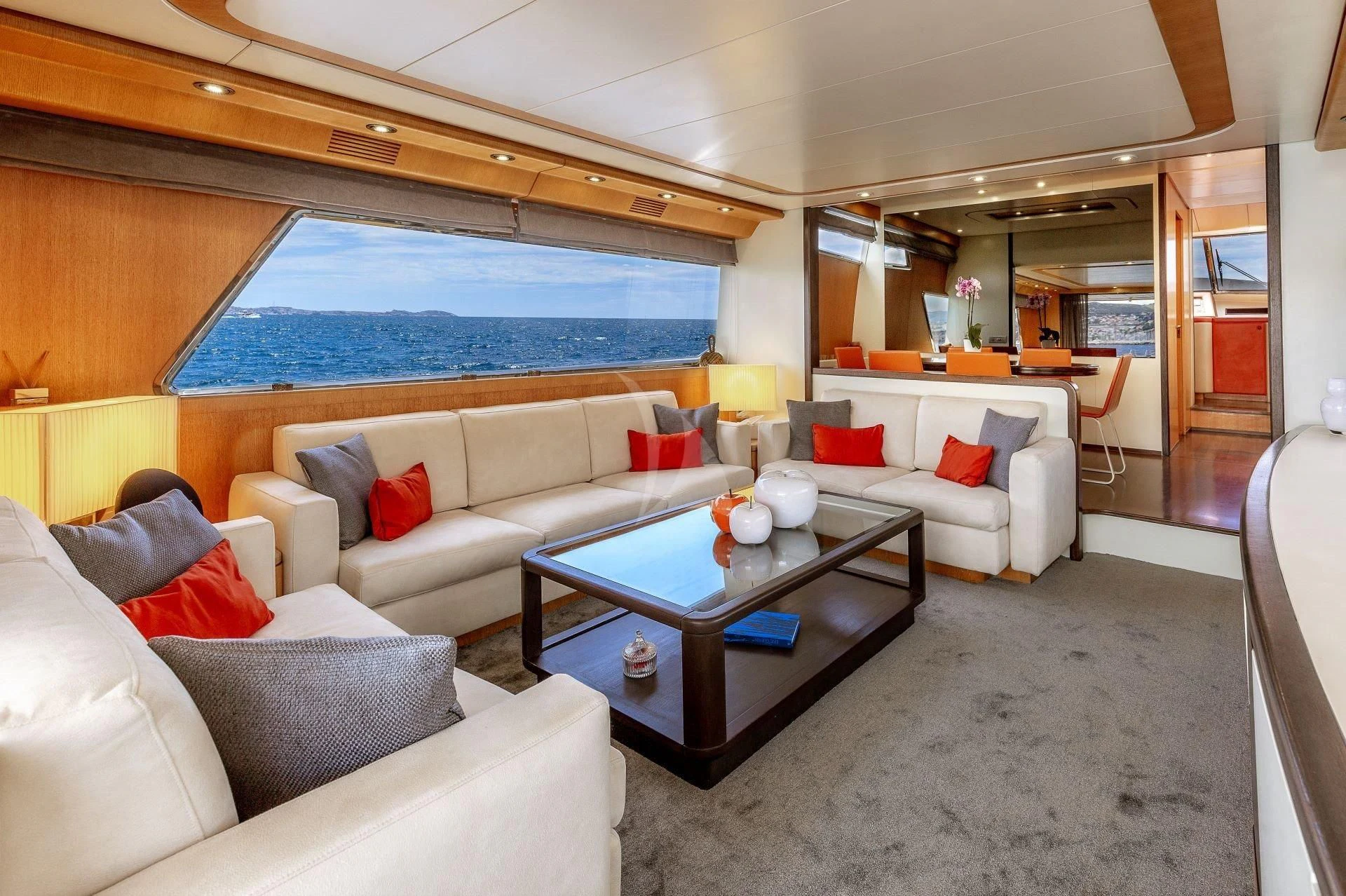 a living room with a large window aboard LOLEA Yacht for Charter