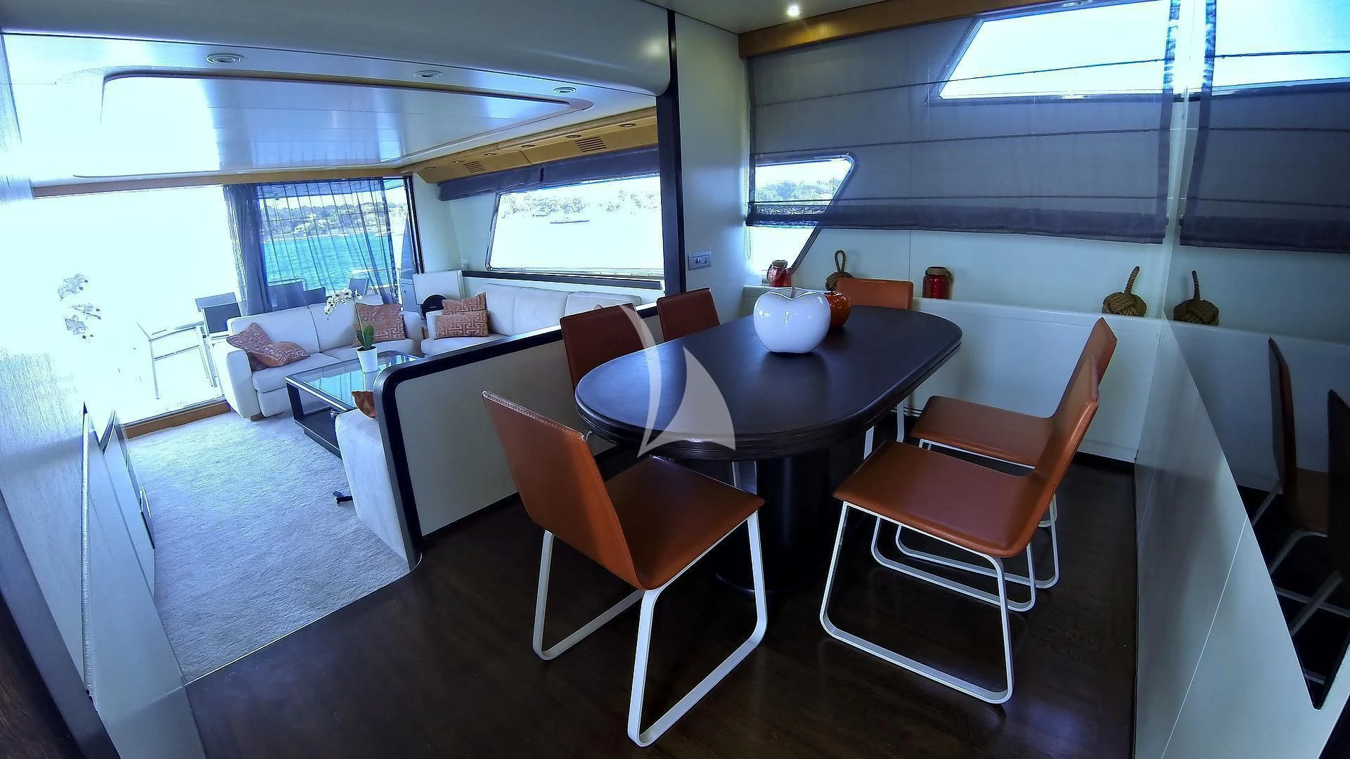 a room with tables chairs and a window aboard LOLEA Yacht for Charter