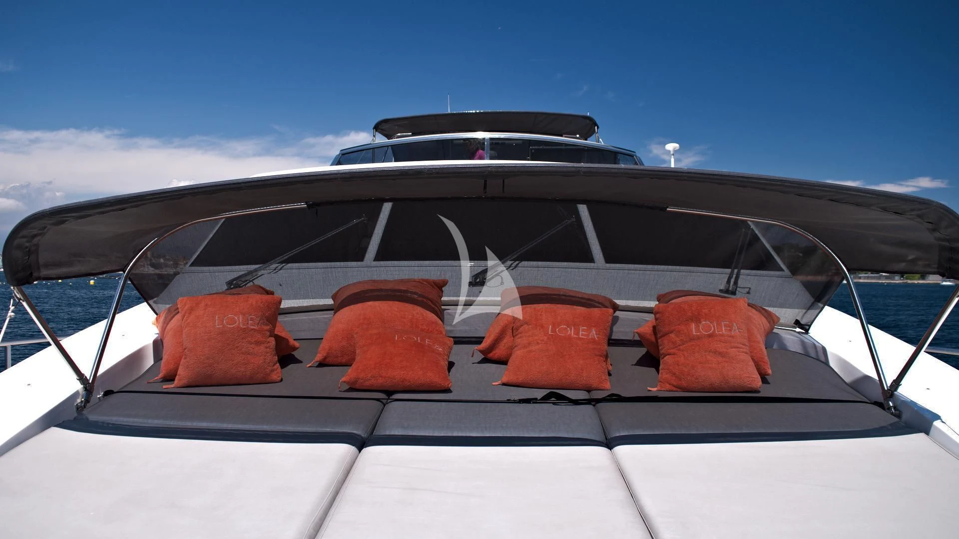 a boat with orange towels on the front aboard LOLEA Yacht for Charter