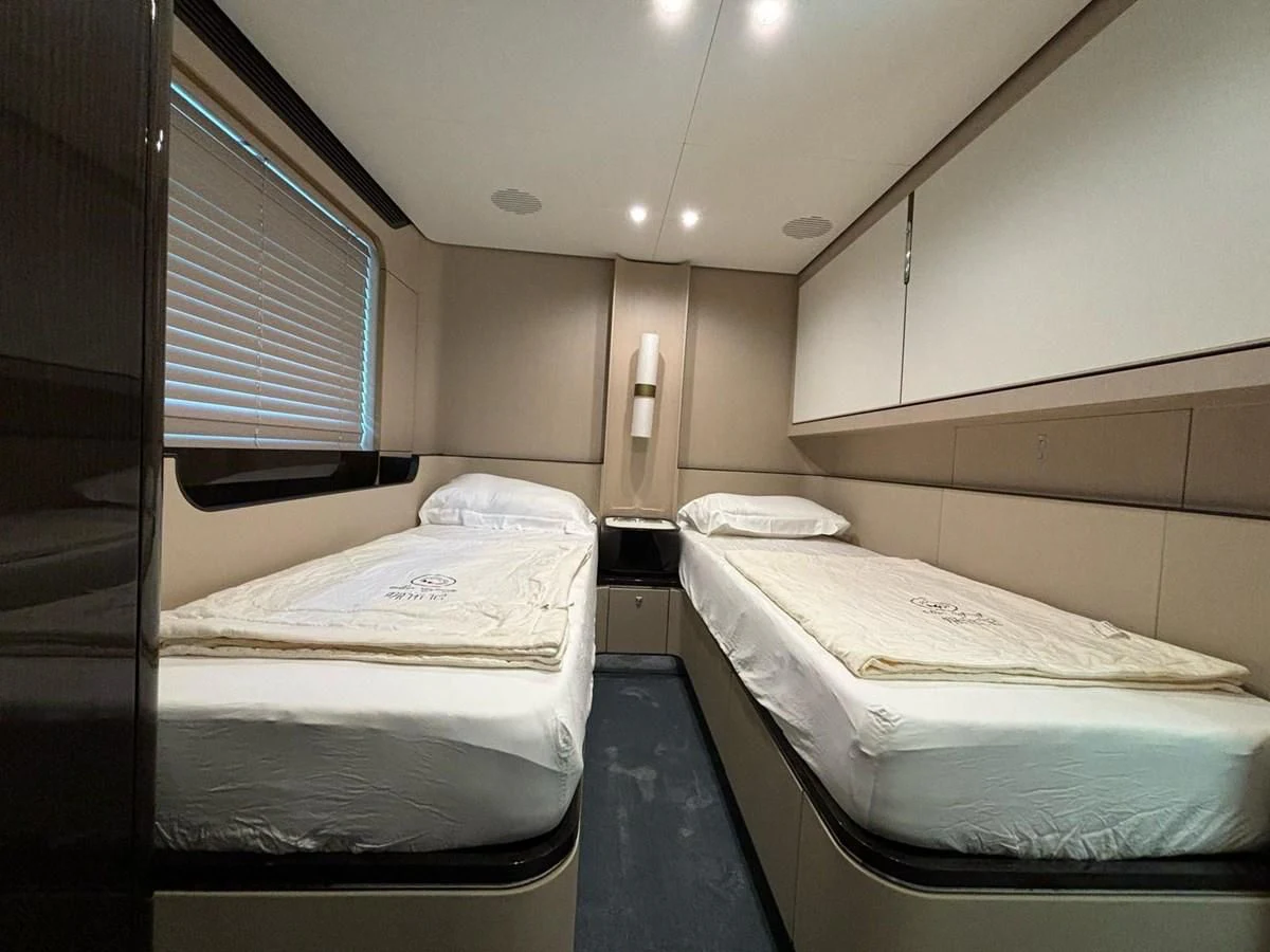 a room with two beds aboard INFINITE VOYAGE III Yacht for Sale
