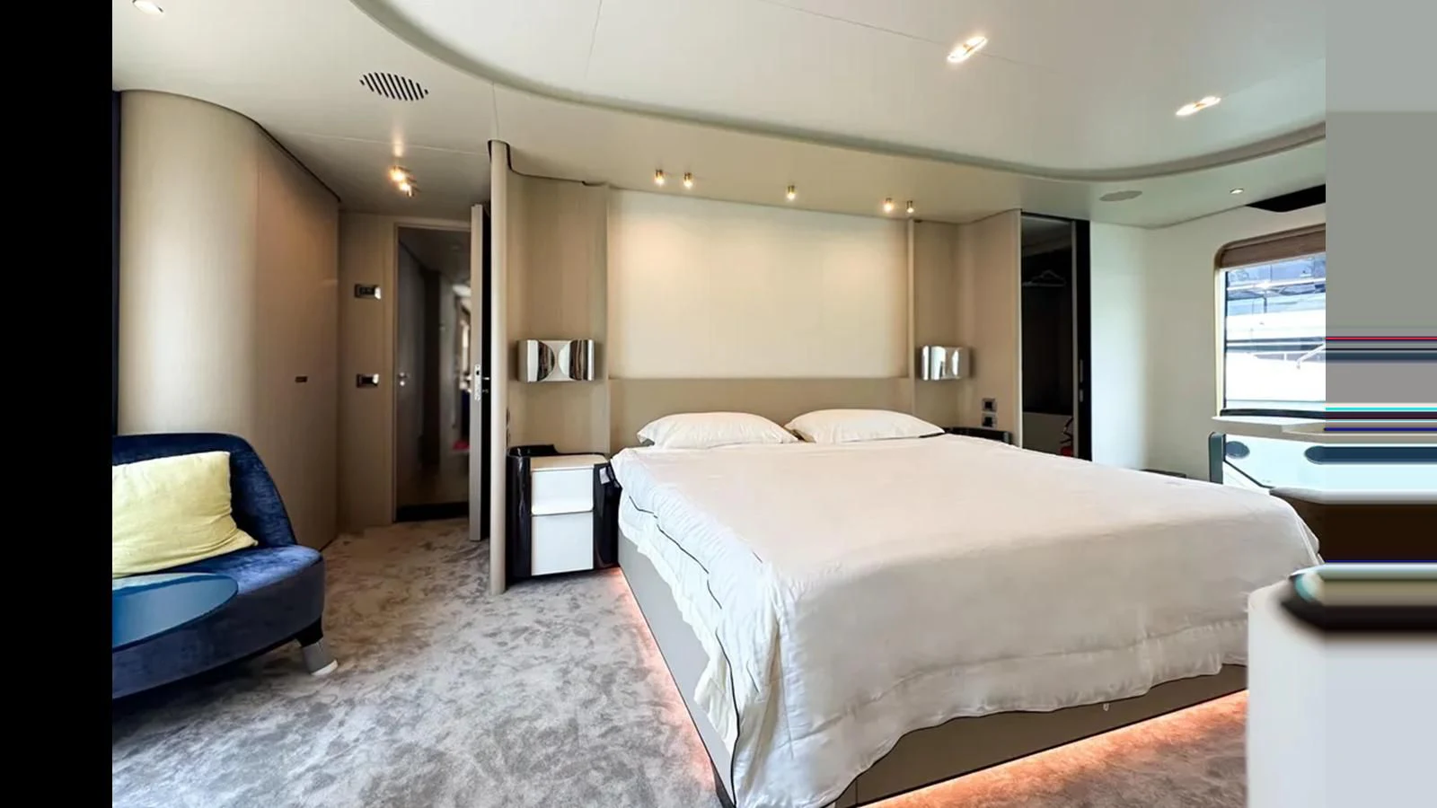 a large bedroom with a bed aboard INFINITE VOYAGE III Yacht for Sale