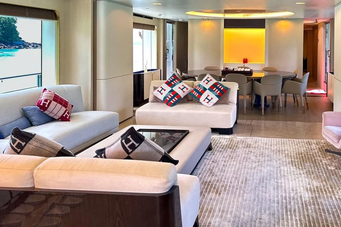 a living room with couches and a table aboard INFINITE VOYAGE III Yacht for Sale