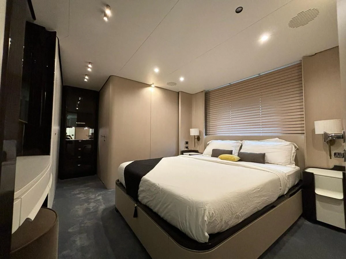 a hotel room with a bed aboard INFINITE VOYAGE III Yacht for Sale
