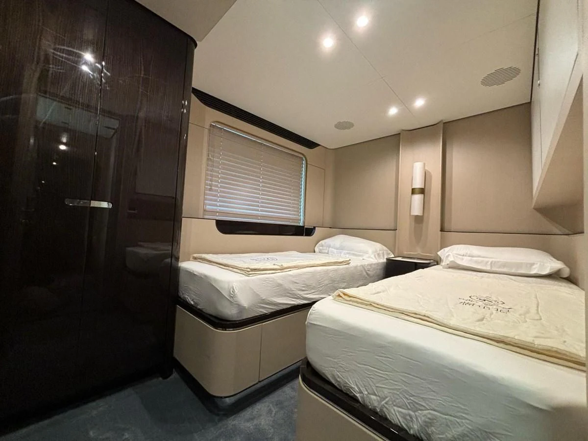 a room with two beds aboard INFINITE VOYAGE III Yacht for Sale