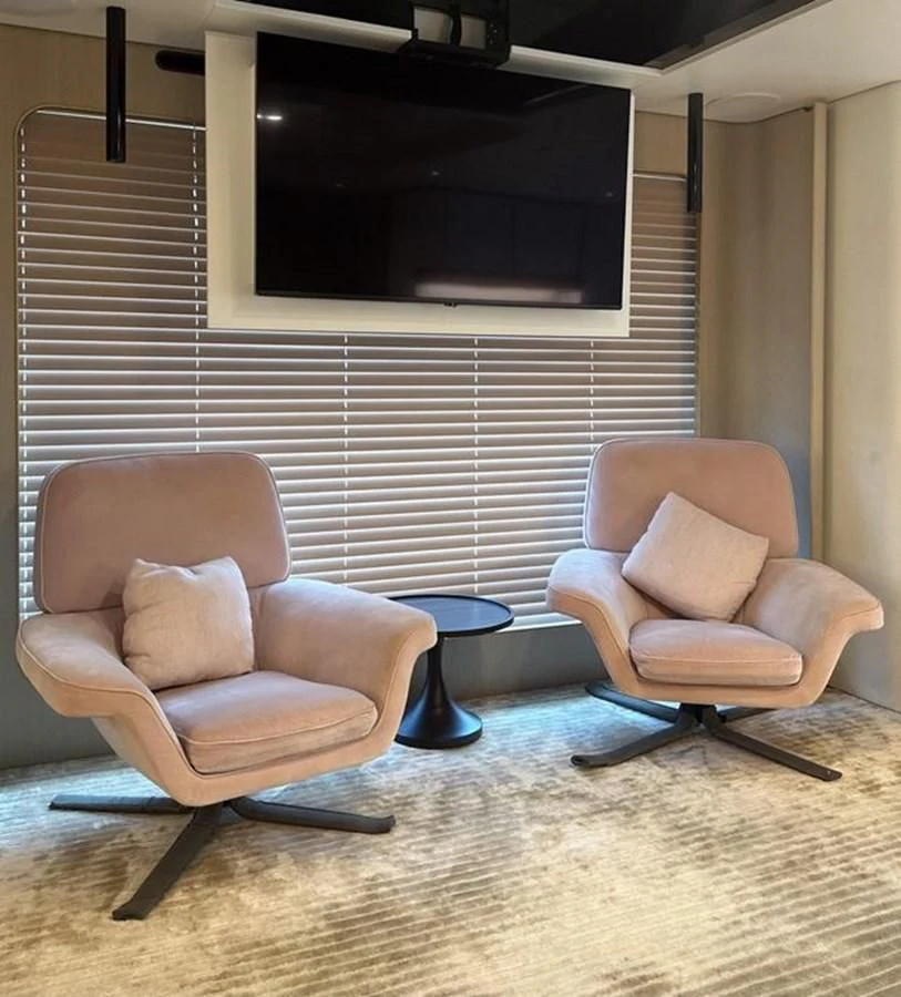 a couple of chairs in a room aboard INFINITE VOYAGE III Yacht for Sale