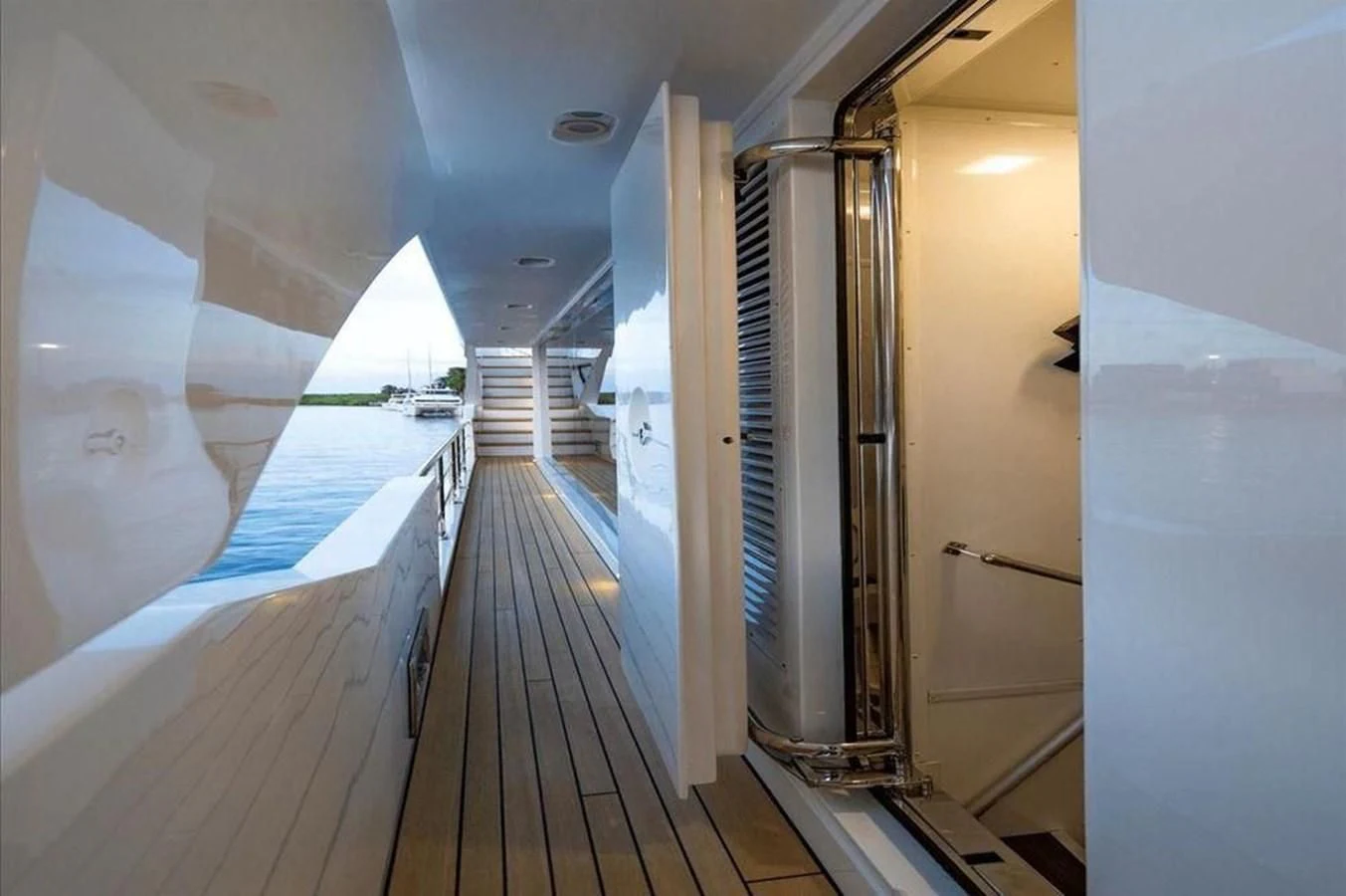 a long hallway with a white ceiling aboard INFINITE VOYAGE III Yacht for Sale
