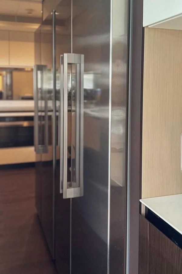a large glass cabinet aboard INFINITE VOYAGE III Yacht for Sale