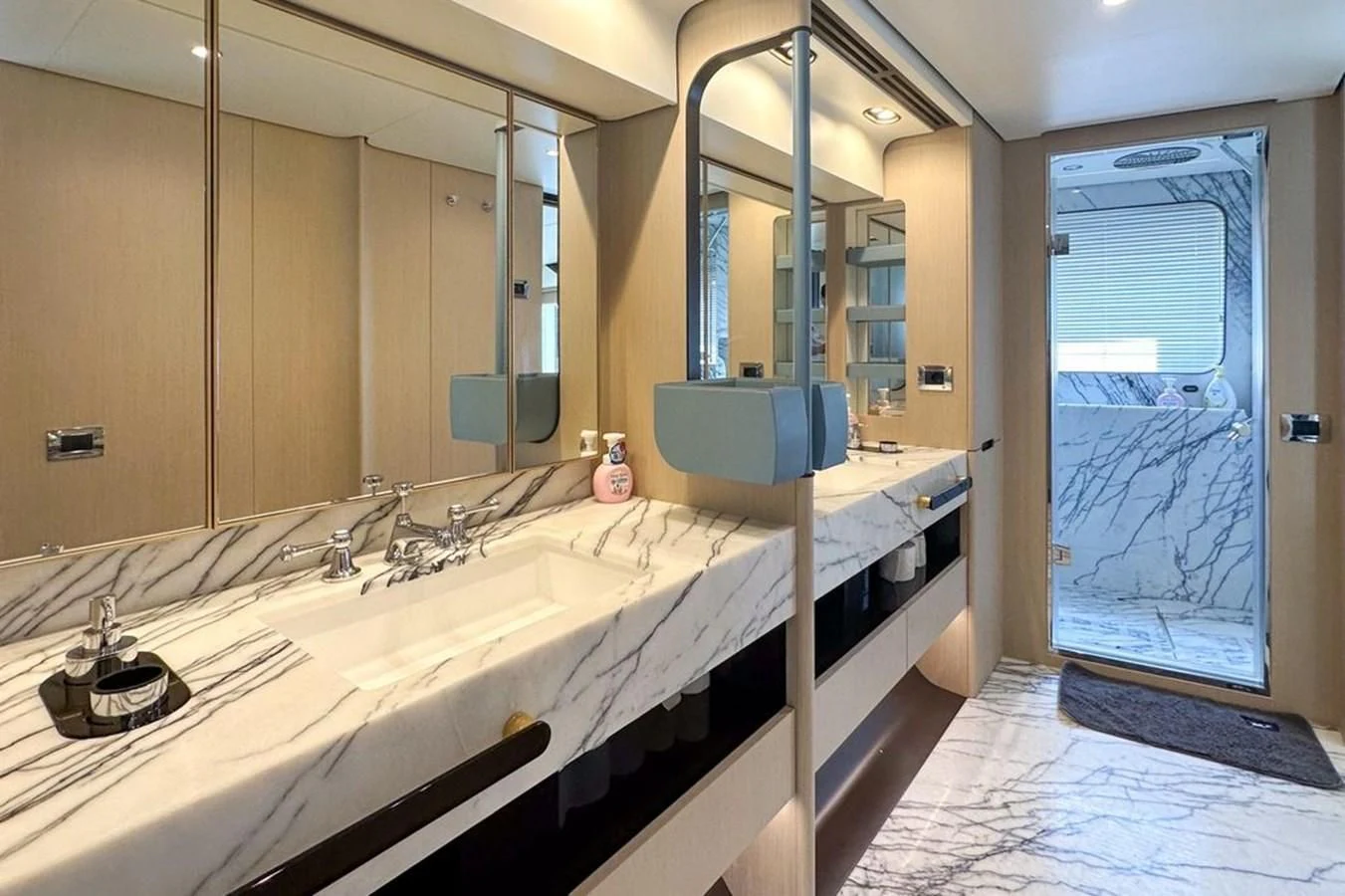a bathroom with a large mirror aboard INFINITE VOYAGE III Yacht for Sale