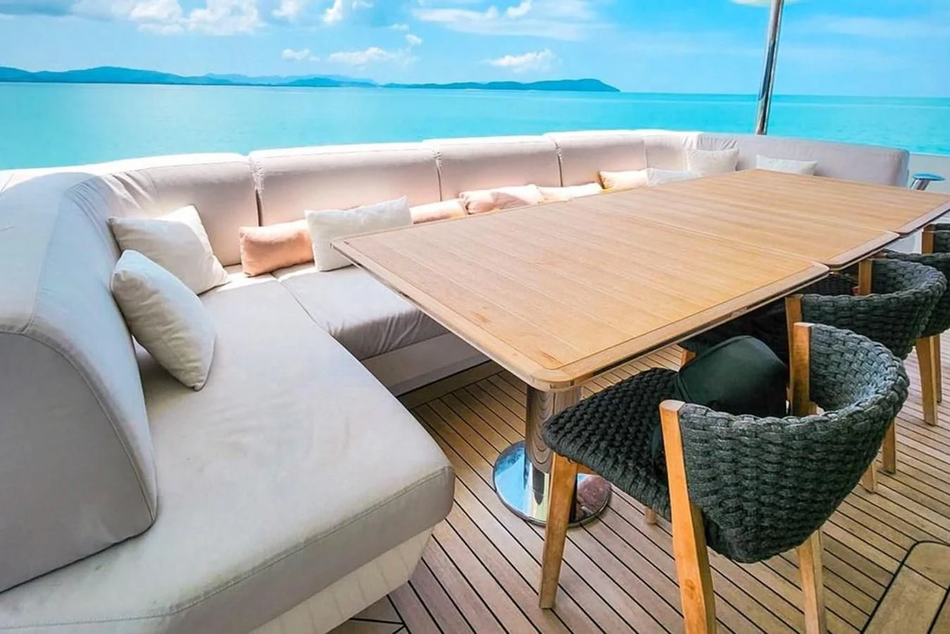 a table on a deck aboard INFINITE VOYAGE III Yacht for Sale