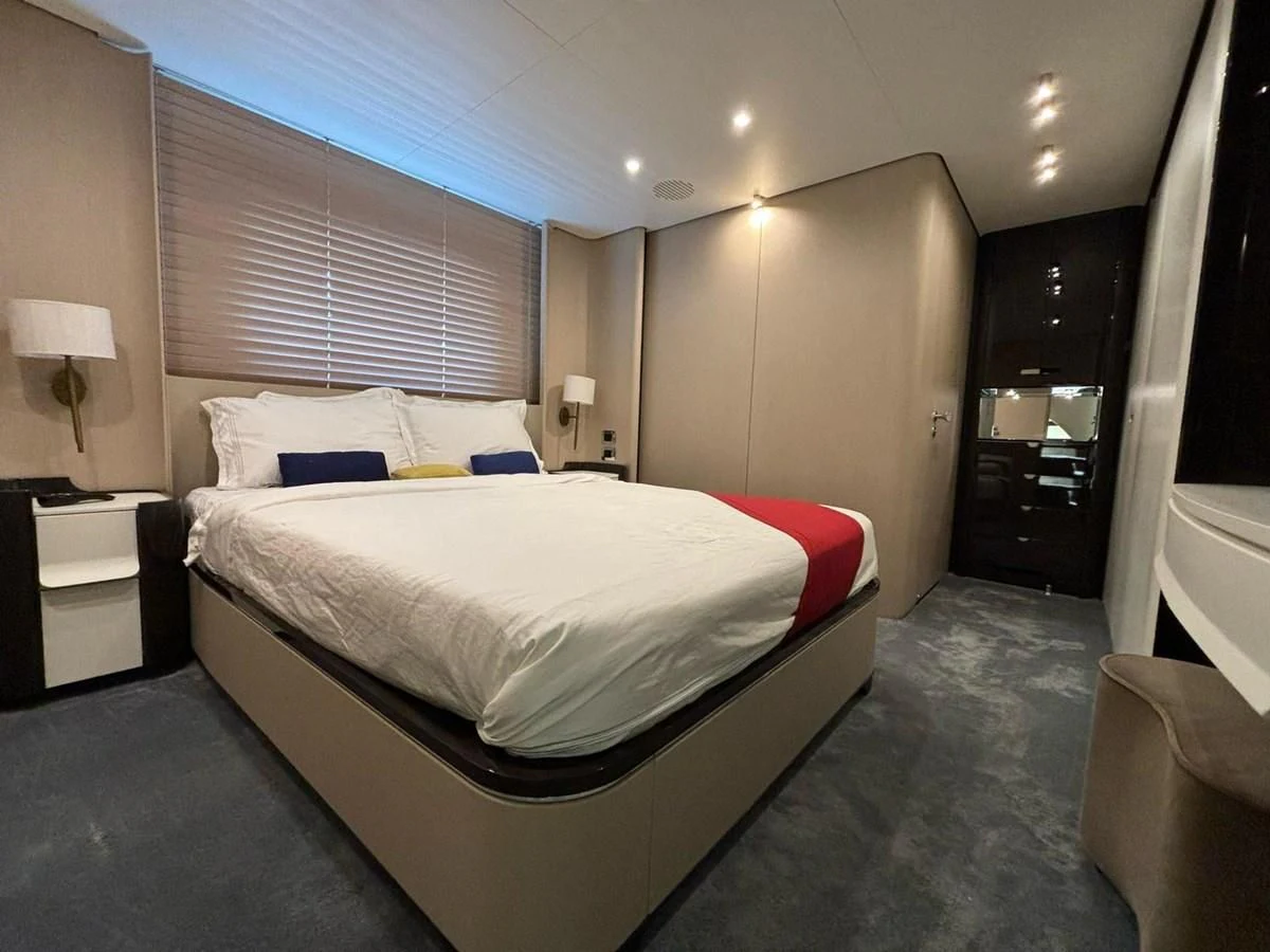 a hotel room with a bed aboard INFINITE VOYAGE III Yacht for Sale