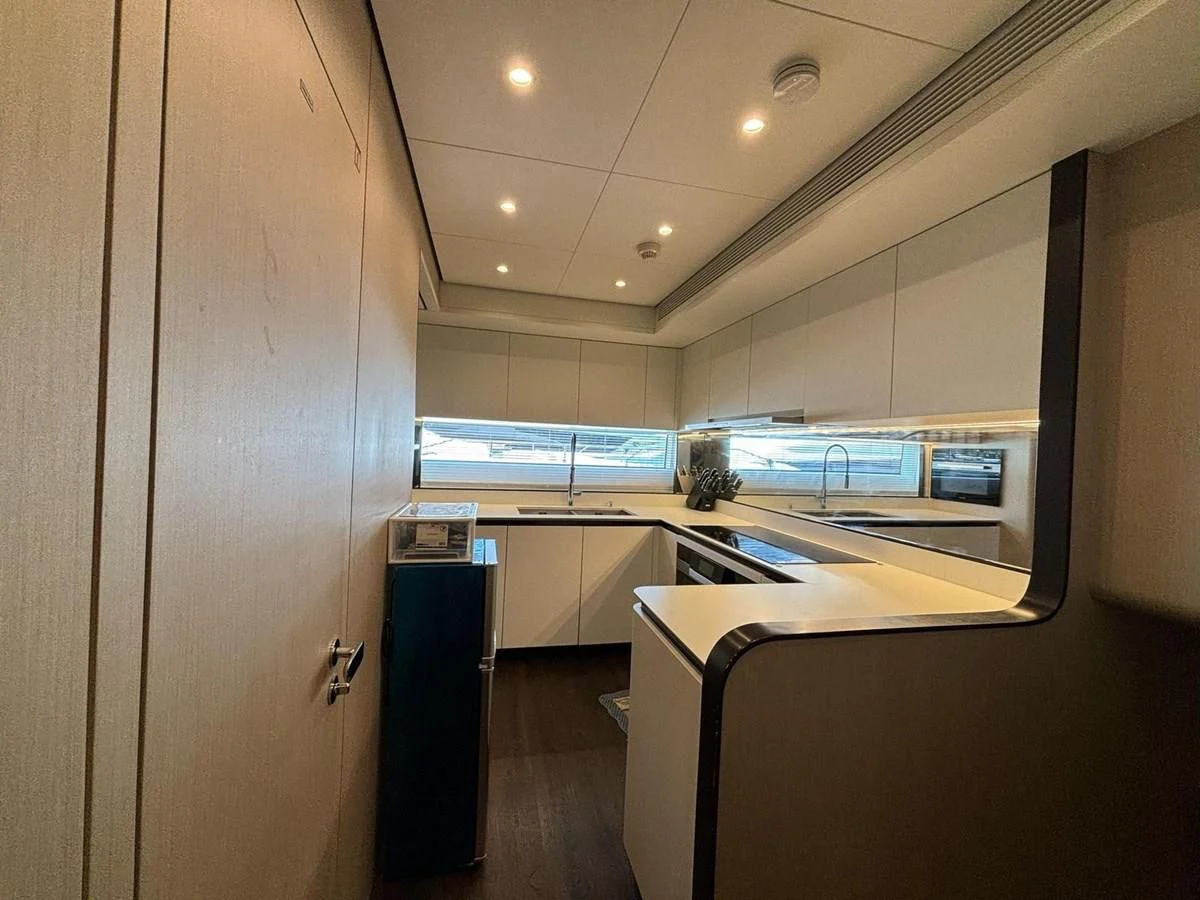 a room with a desk and computer aboard INFINITE VOYAGE III Yacht for Sale