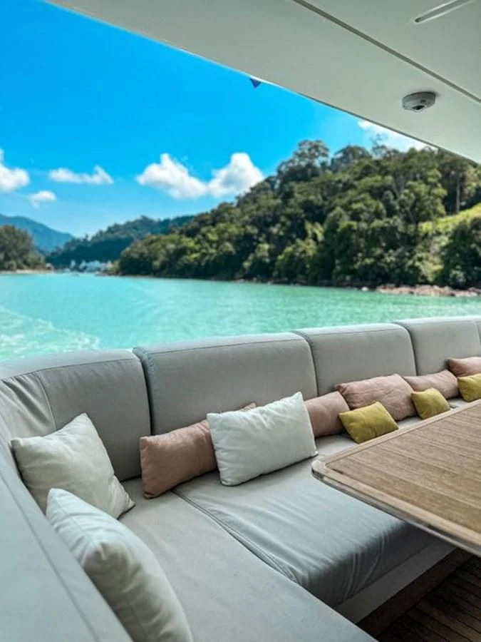 a couch on a boat aboard INFINITE VOYAGE III Yacht for Sale