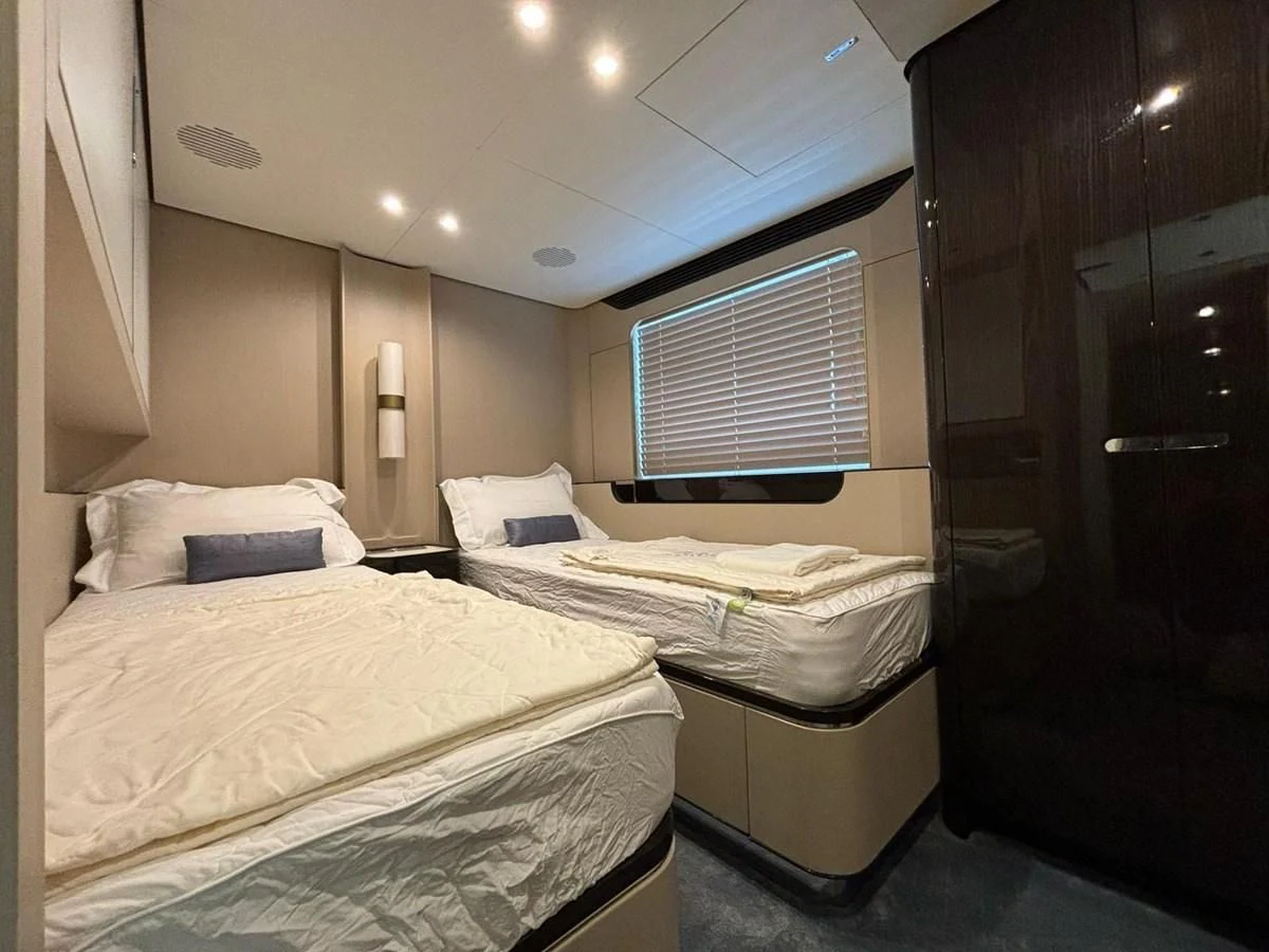 a couple of beds in a hotel room aboard INFINITE VOYAGE III Yacht for Sale