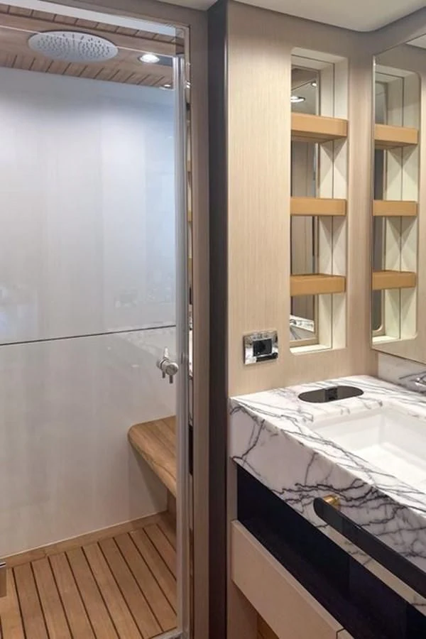 a bathroom with a sink and a shower aboard INFINITE VOYAGE III Yacht for Sale