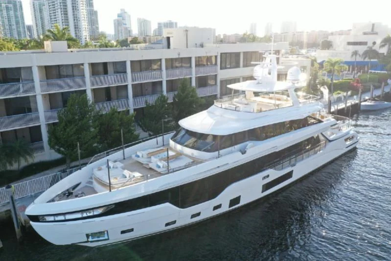 a large white ship in a harbor aboard EYE OF DESTINY Yacht for Sale