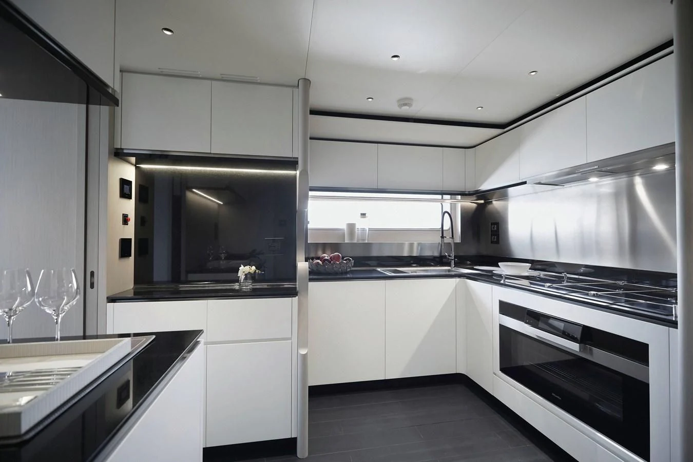 a kitchen with white cabinets aboard EYE OF DESTINY Yacht for Sale